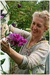elspeth thompson  with flowerss in garden